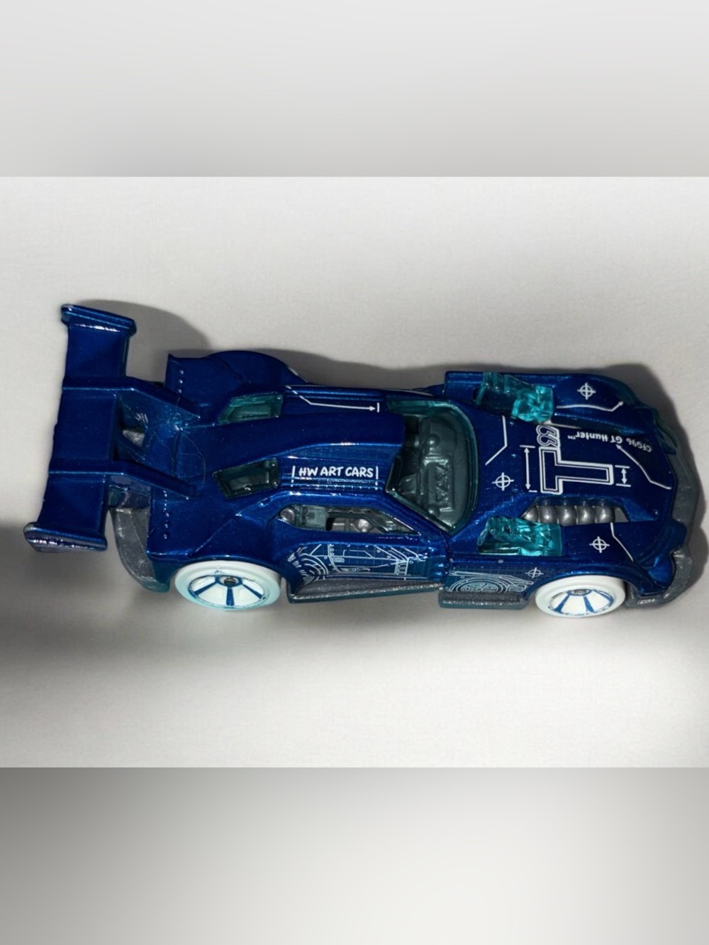 Hot Wheels Hunter Metallic Blue Die-Cast Racing Car with White Wheels